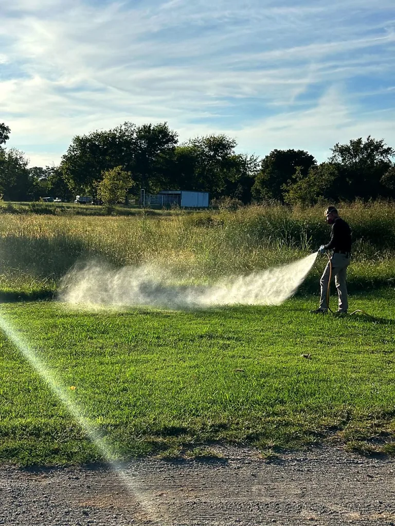Bret Elza treating a residential yard for mosquitoes and ticks