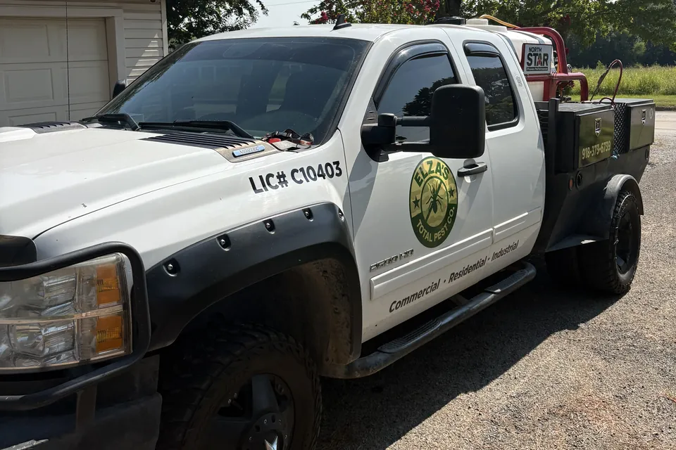 Elza’s Total Pest Control branded truck and equipment